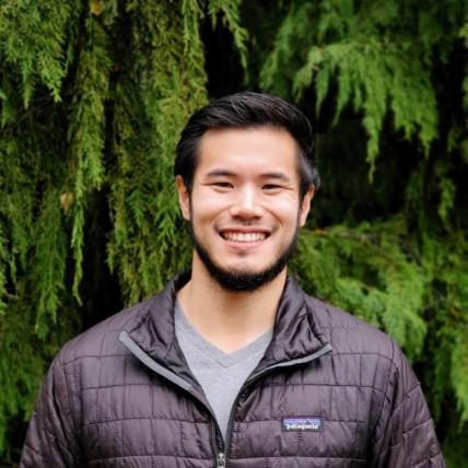 Portrait of Chris Law in front of trees, Biology Acting Instructor & Burke Museum Affiliate Curator