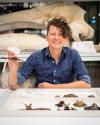 student with bat specimen