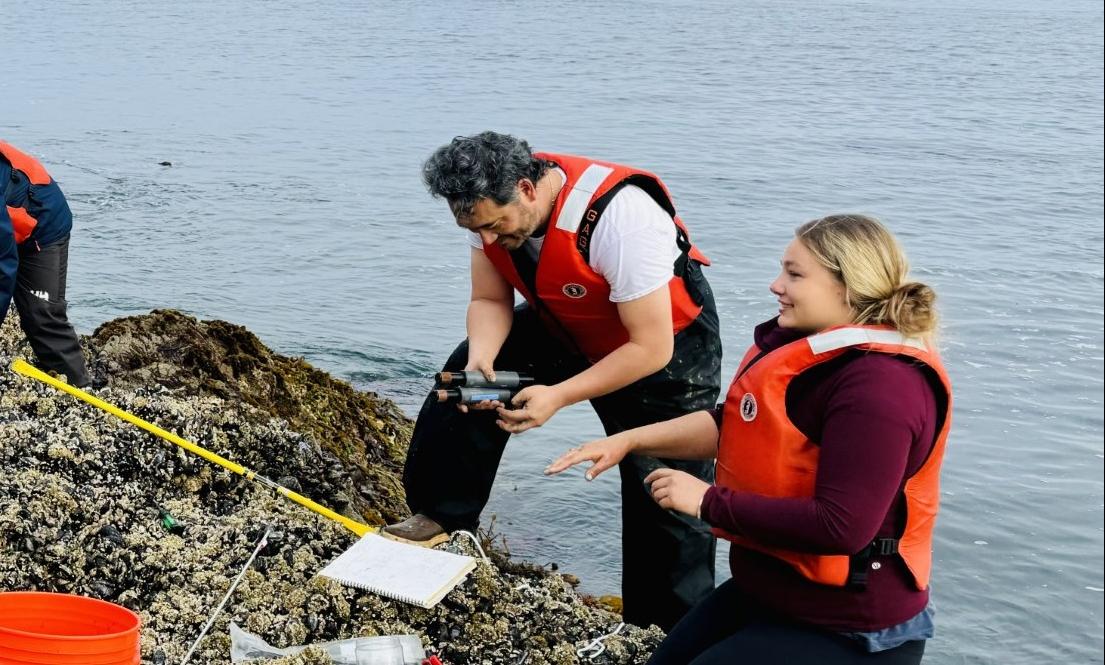 People conducting research seaside