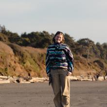 Headshot of Amy Moore smiling on a beach.