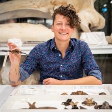 student with bat specimen